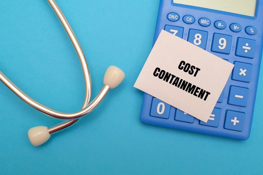 A stethoscope alongside a calculator representing healthcare costs